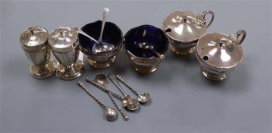 A George V silver six piece condiment set by Mappin & Webb, Birmingham, 1923/4 and six associated spoons ( 4 silver).